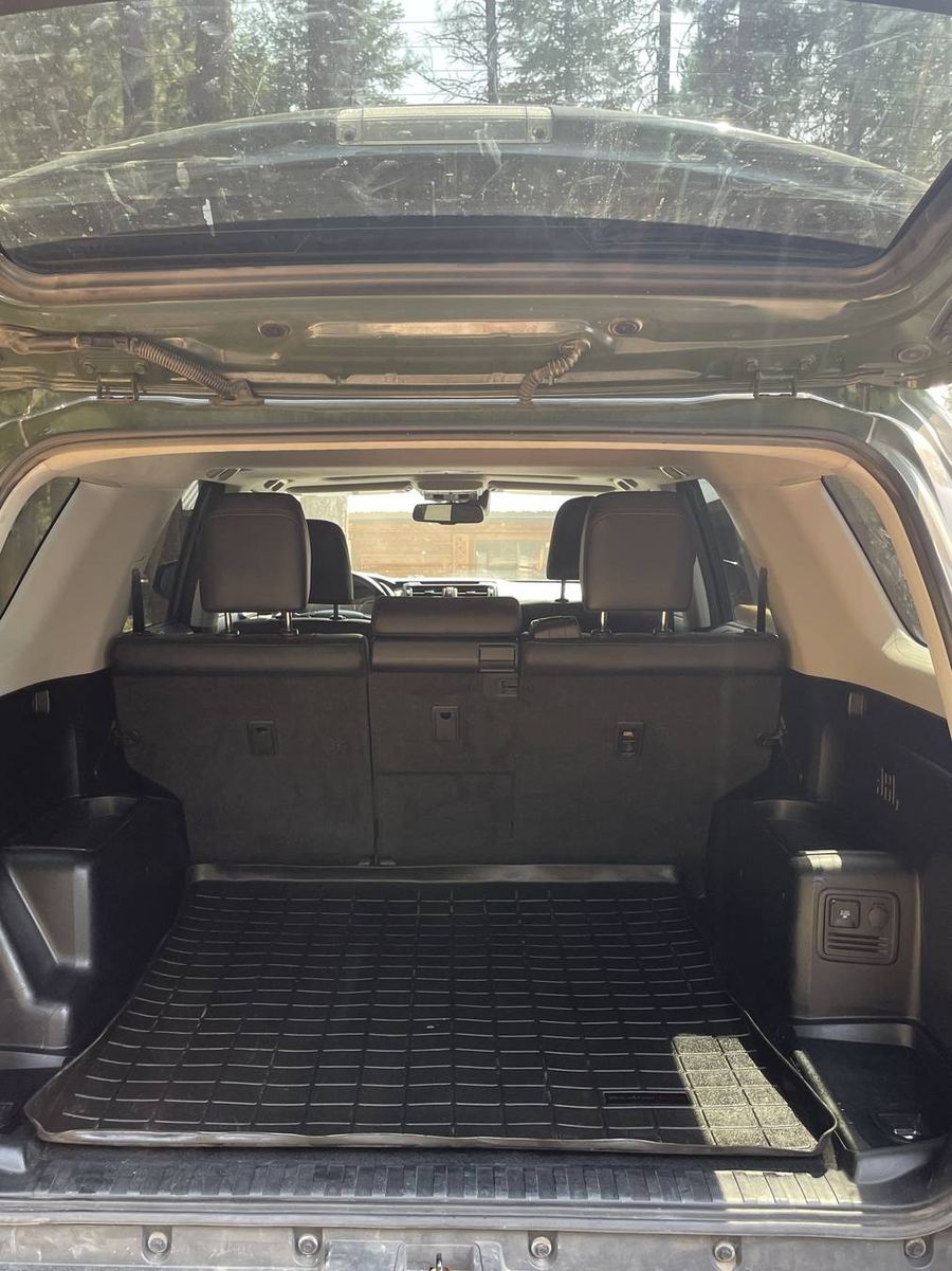 Toyota 4Runner TRD Pro cargo area after detailing — liner washed clean from the seat backs to the tailgate lip