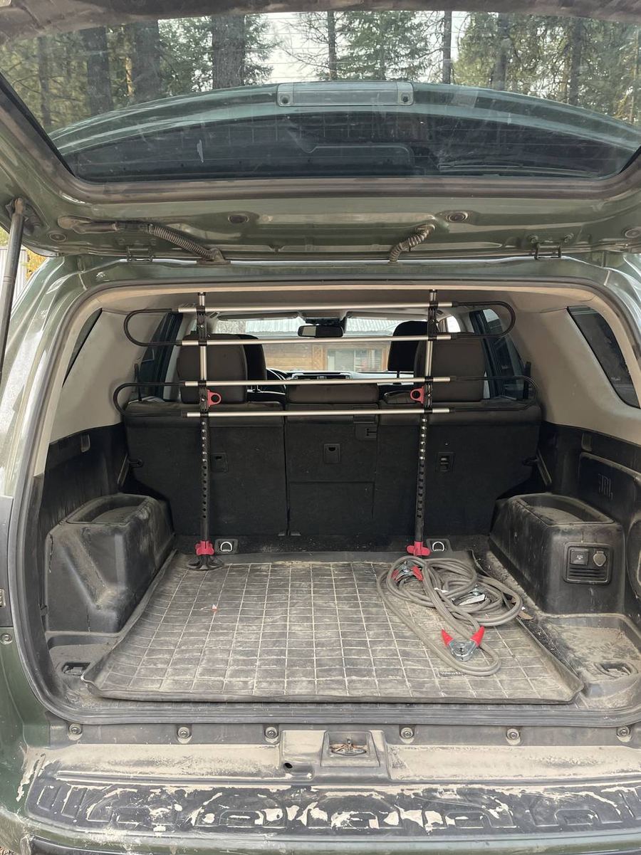 Toyota 4Runner TRD Pro cargo area before detailing — a tow strap and dirt across the cargo liner
