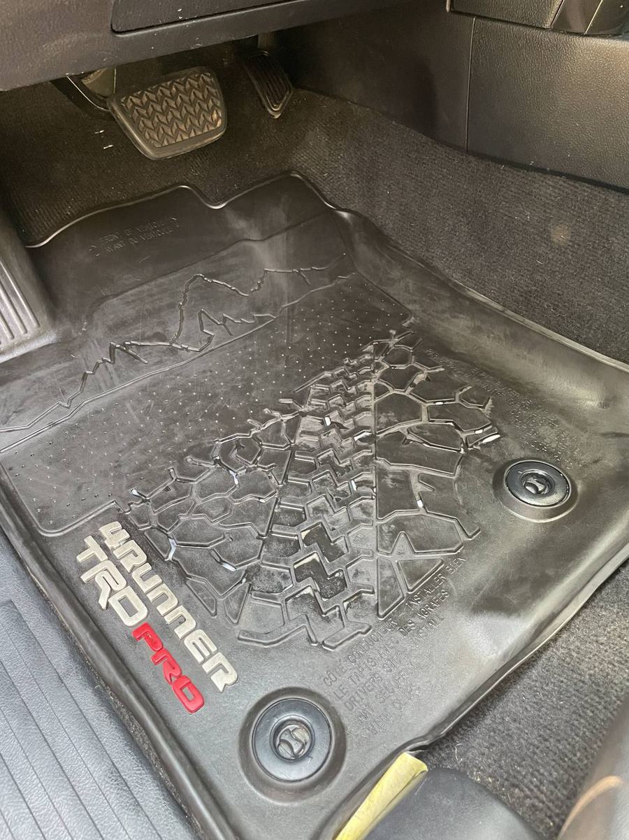 Toyota 4Runner TRD Pro driver floor mat after detailing — clean black rubber with the TRD Pro lettering legible again
