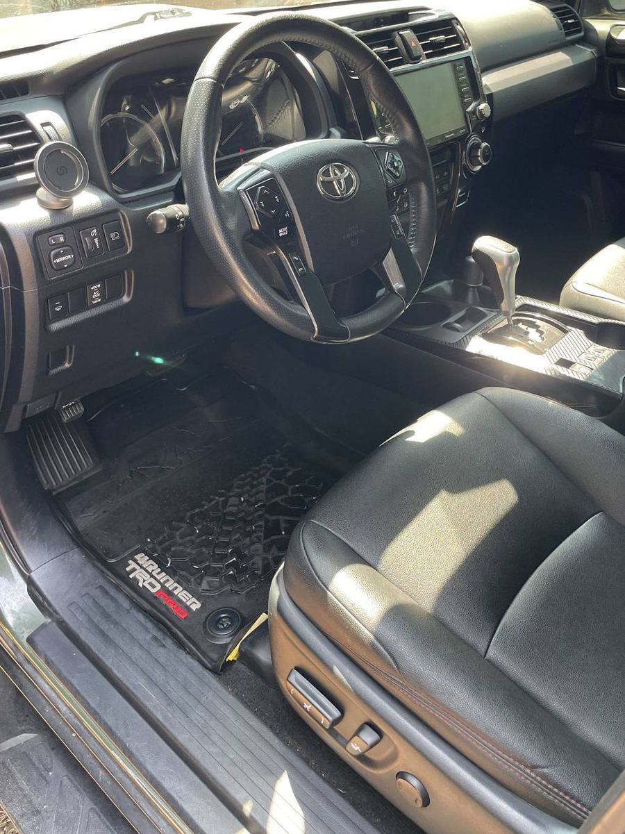 Toyota 4Runner TRD Pro driver's side after detailing — sill, seat base and kick panel wiped clean