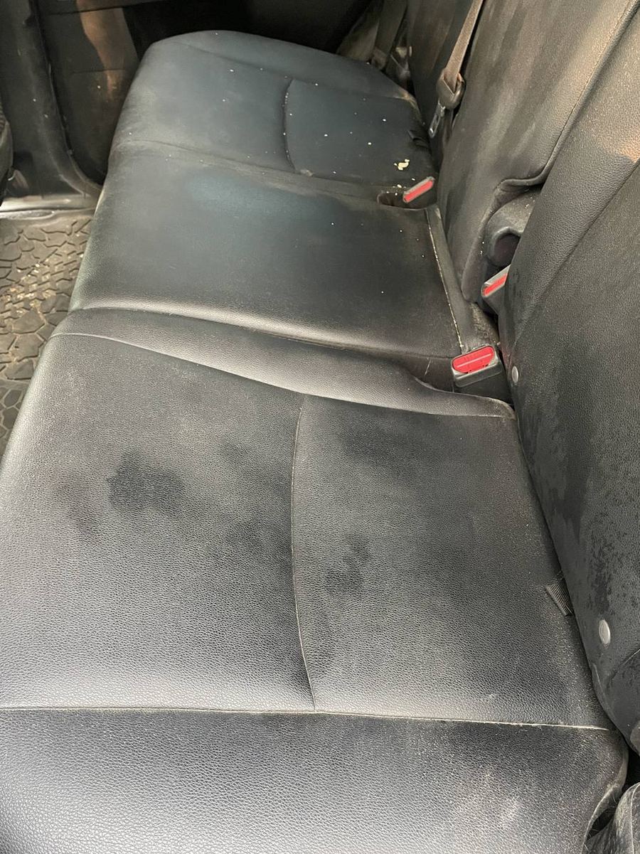 Toyota 4Runner TRD Pro rear bench before detailing — dust and grit worked into the seams and stitching