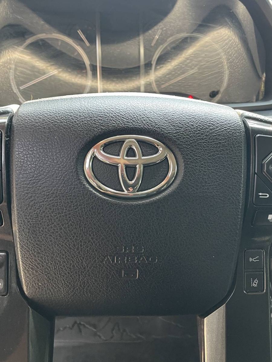 Toyota 4Runner TRD Pro steering wheel after detailing — wheel and badge clean into the grain