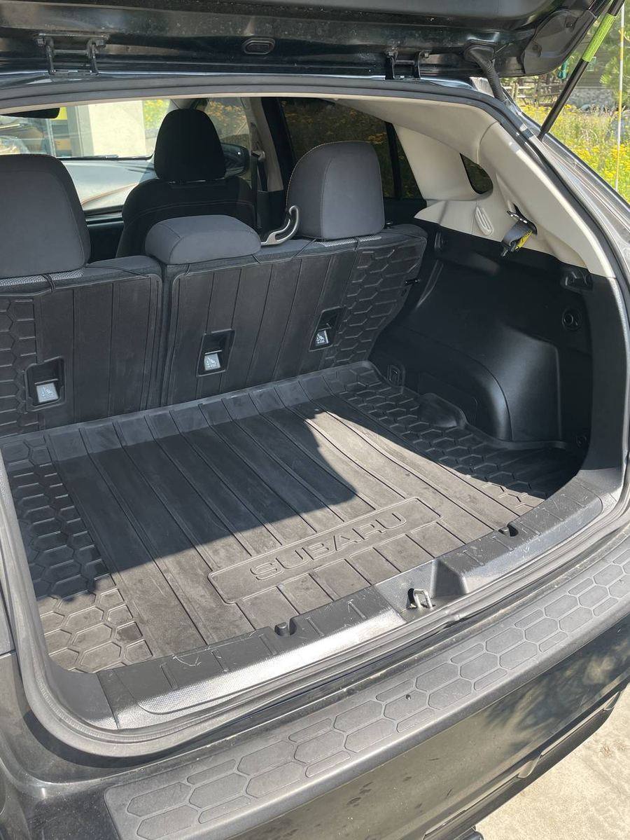 Subaru Crosstrek cargo area after detailing — liner and seat backs cleaned corner to corner