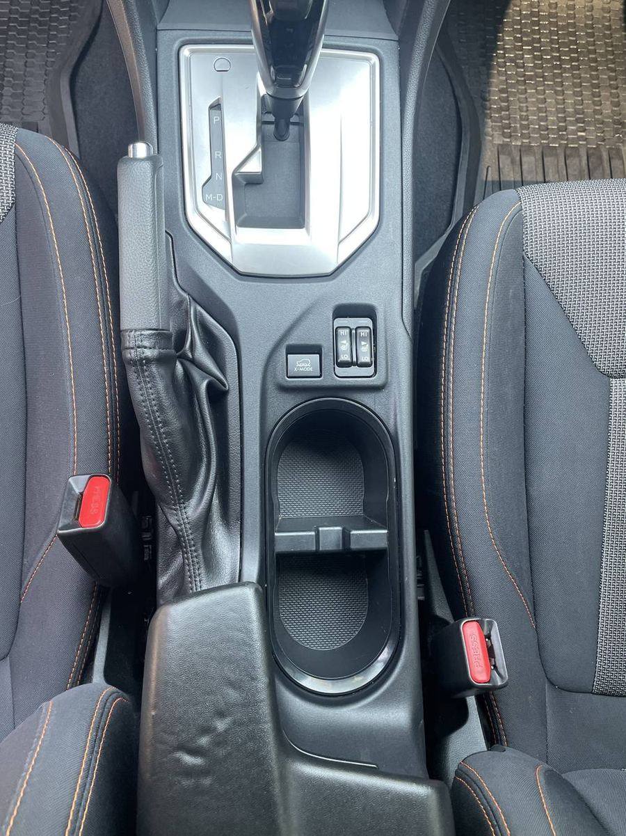 Subaru Crosstrek center console after detailing — cup holders and shifter surround clean