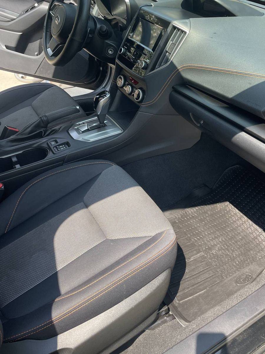 Subaru Crosstrek front cabin after detailing — dash, vents and trim at an even low sheen