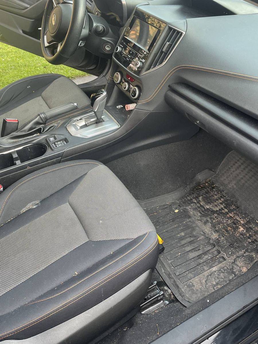 Subaru Crosstrek front cabin before detailing — dust settled across the dash and vents